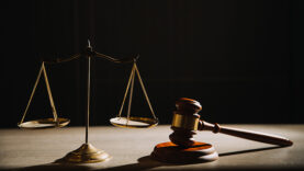 Justice and law concept.Male judge in a courtroom with the gavel
